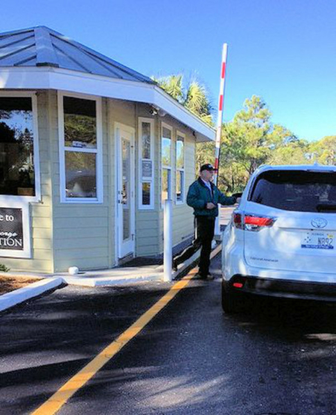 Entrance gate with security guard.